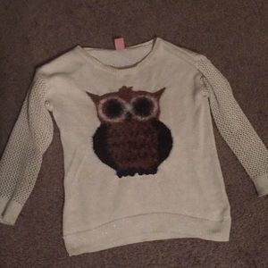 A white shirt with a owl on it